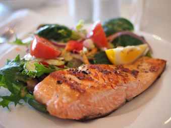 brown fish fillet on white ceramic plate